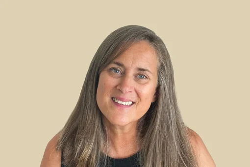 Dana Gentry, Case Manager Professional headshot of Dana Gentry, a case manager, with long hair smiling against a brown background.