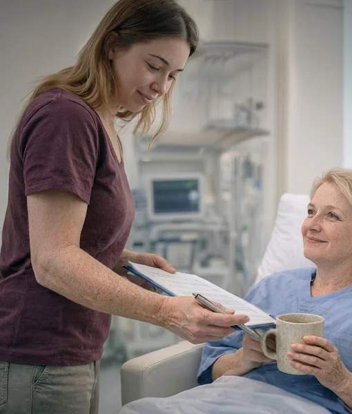A female physical therapist in a white uniform guiding a male patient through arm mobility exercises in a bright, modern therapy clinic.