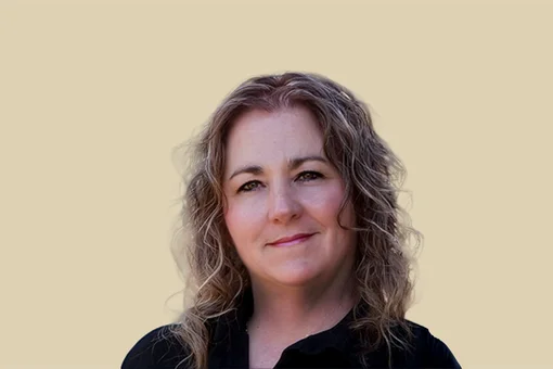 Colleen Gibson, Case Manager Professional headshot of Colleen Gibson, a case manager, smiling against a brown background.